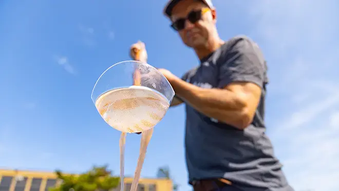 Sean Colin holds a jellyfish.