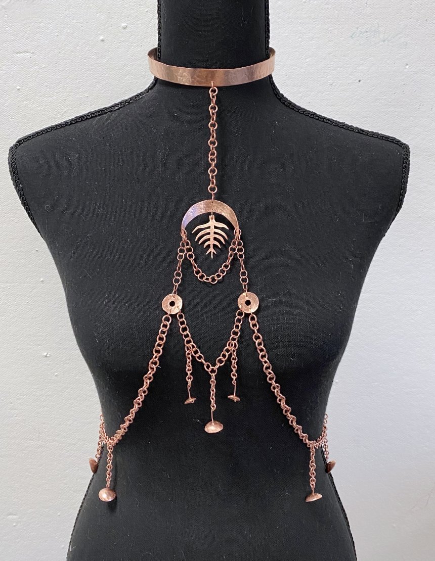 Jewelry made by Sophia Hess on a mannequin.