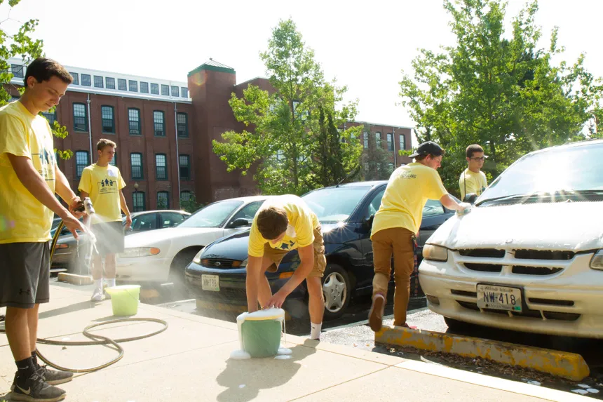 Students washing cars