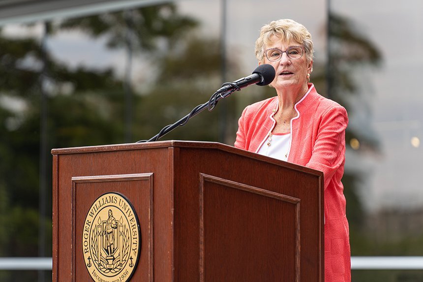 Joyce Cummings speaking at a podium