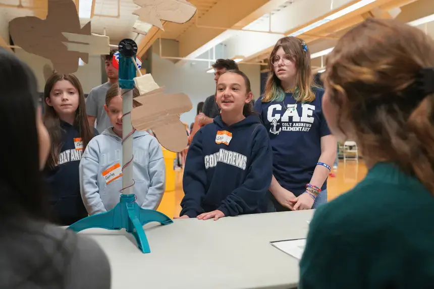 Fourth graders speak to professionals at the Celebration Event.