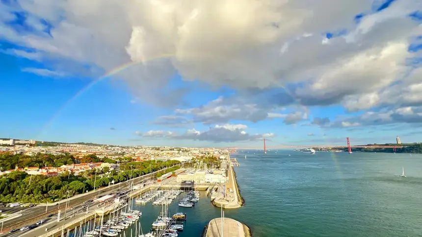 A scenic photo of Portugal featuring a rainbow