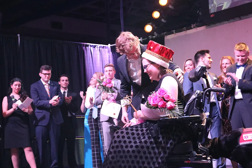 Mr. RWU winner Skyler Moncada with personal assistants Tori Davis and her service dog Toni