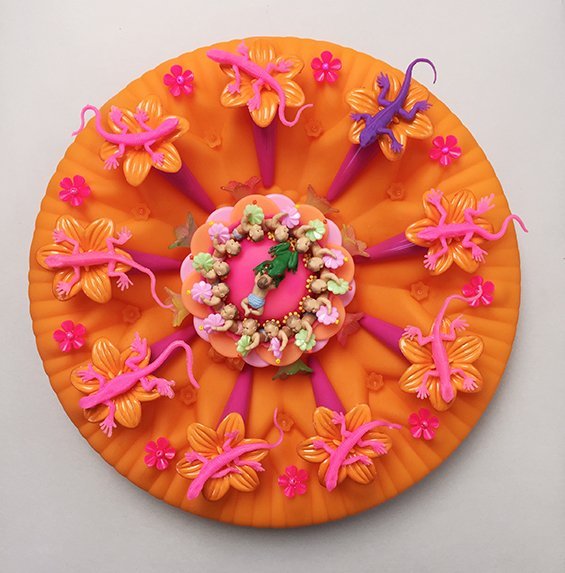 “Against All Odds” assemblage of plastic readymade elements 9” diameter