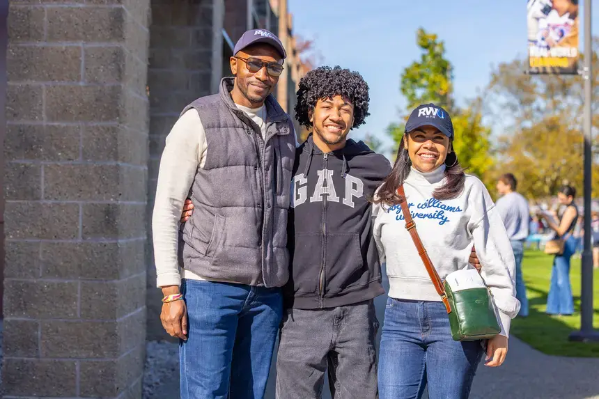 A family poses at Homecoming and Family Weekend.