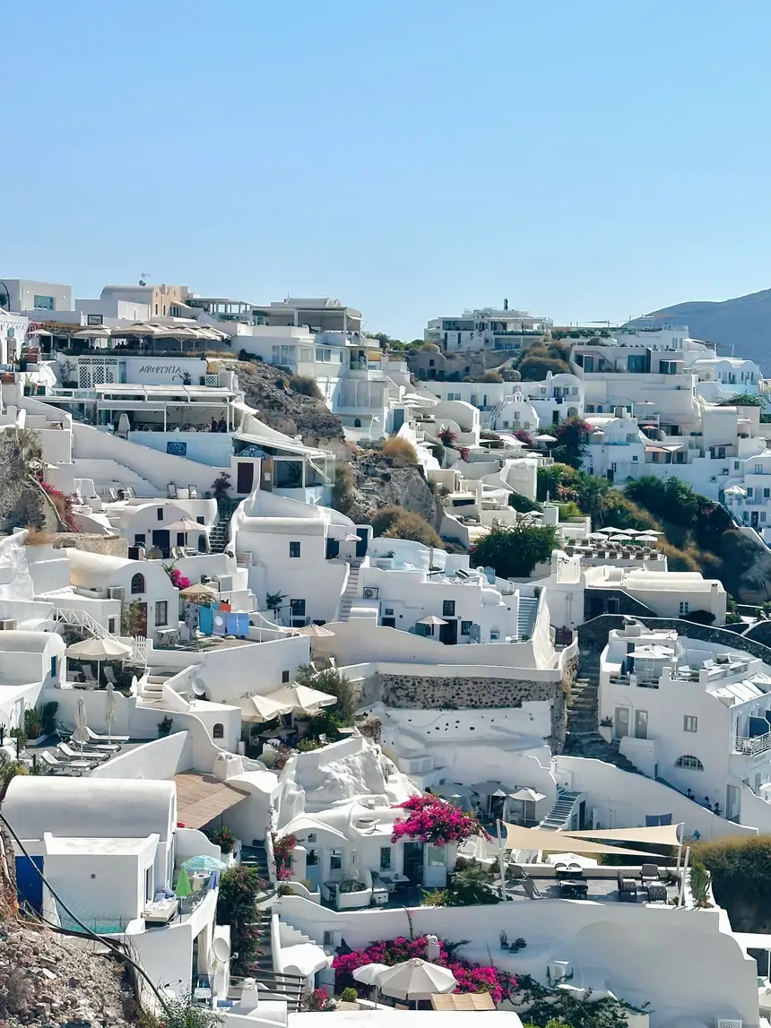 A Greek town built into a hill white white washed buildings