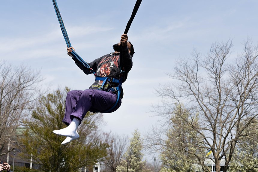A student about to do a backflip on the bungee trampoline. 