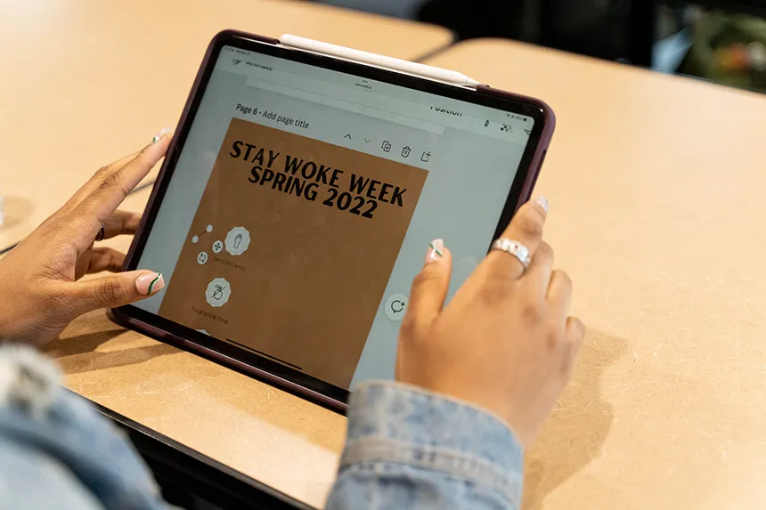 Madison Dixon designs a flyer for Stay Woke Week on her iPad. 