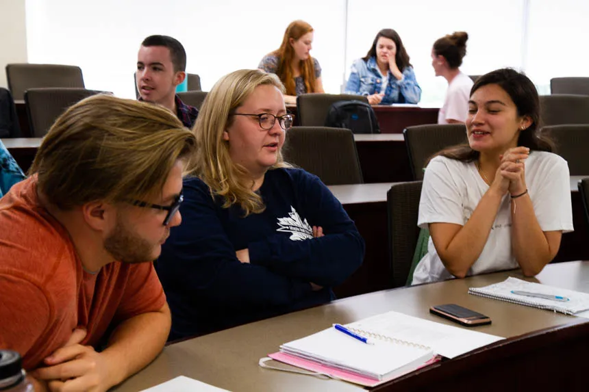 Students discuss in small groups.