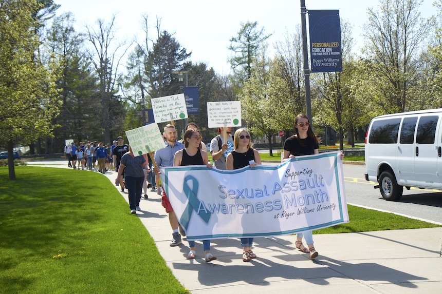 students and faculty walking on campus