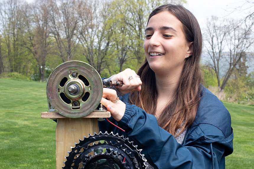An Engineering student with a gear 