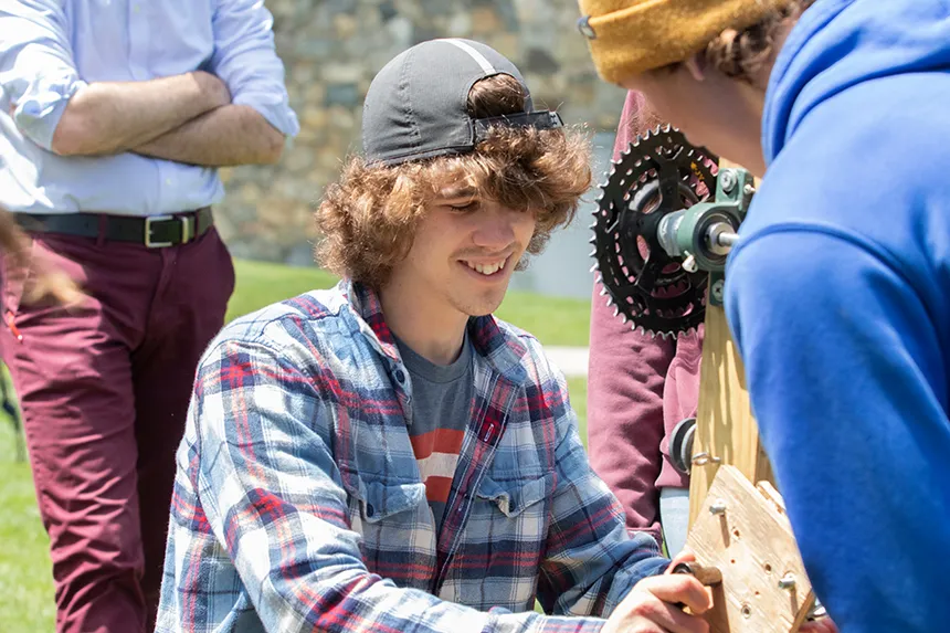 An Engineering student with a gear 