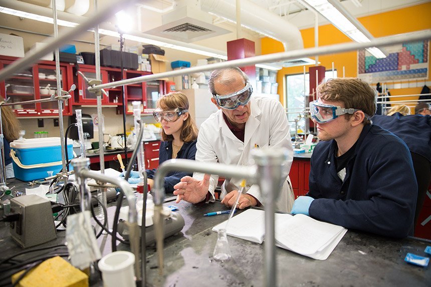 image of students and professor collaborating in a lab