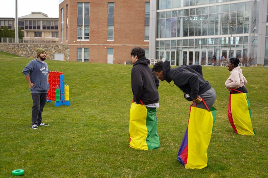 Students participate in a sack race behind GHH.