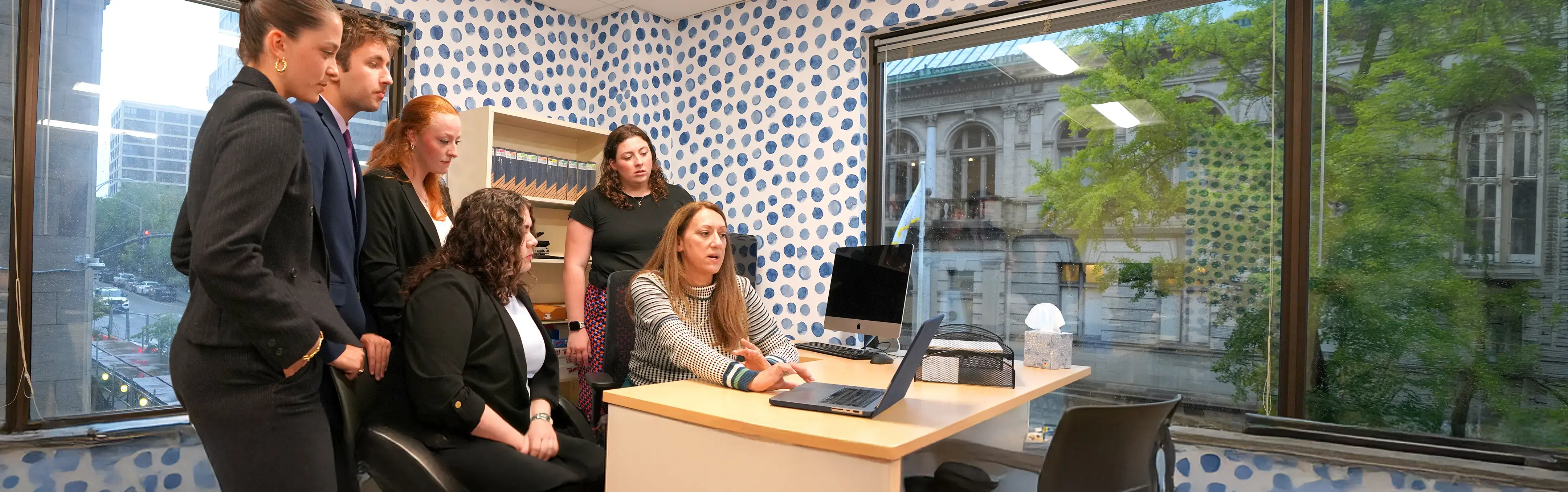 A professor works with students