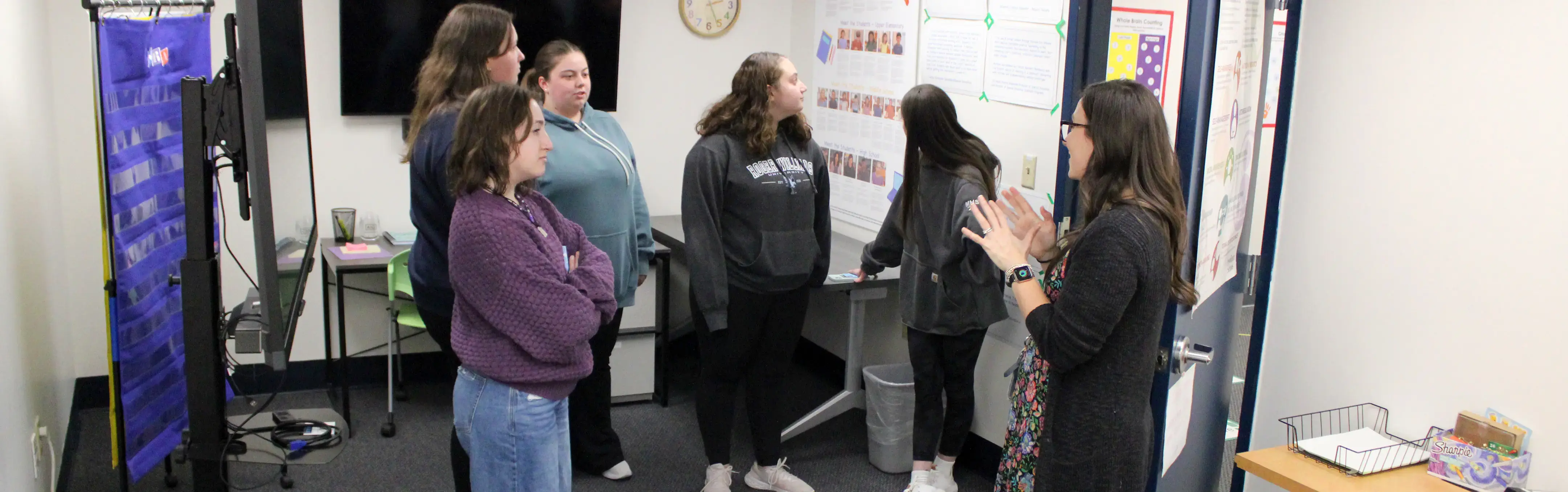 Special Education students explore a special room with guidance
