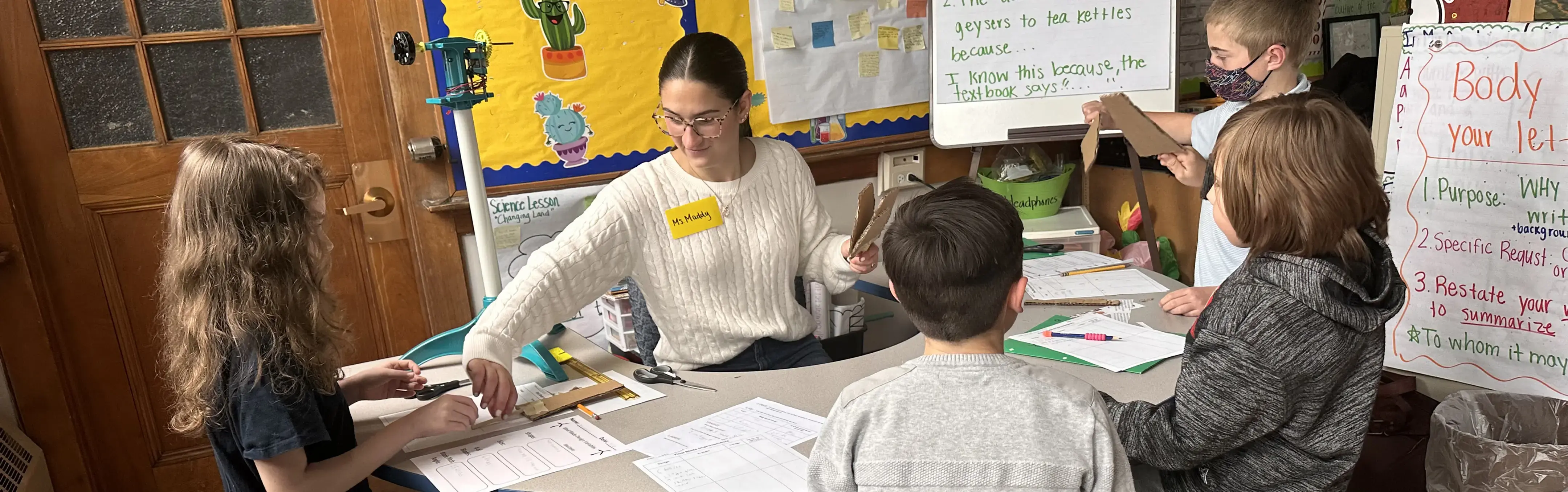 A teacher works in a middle school classroon