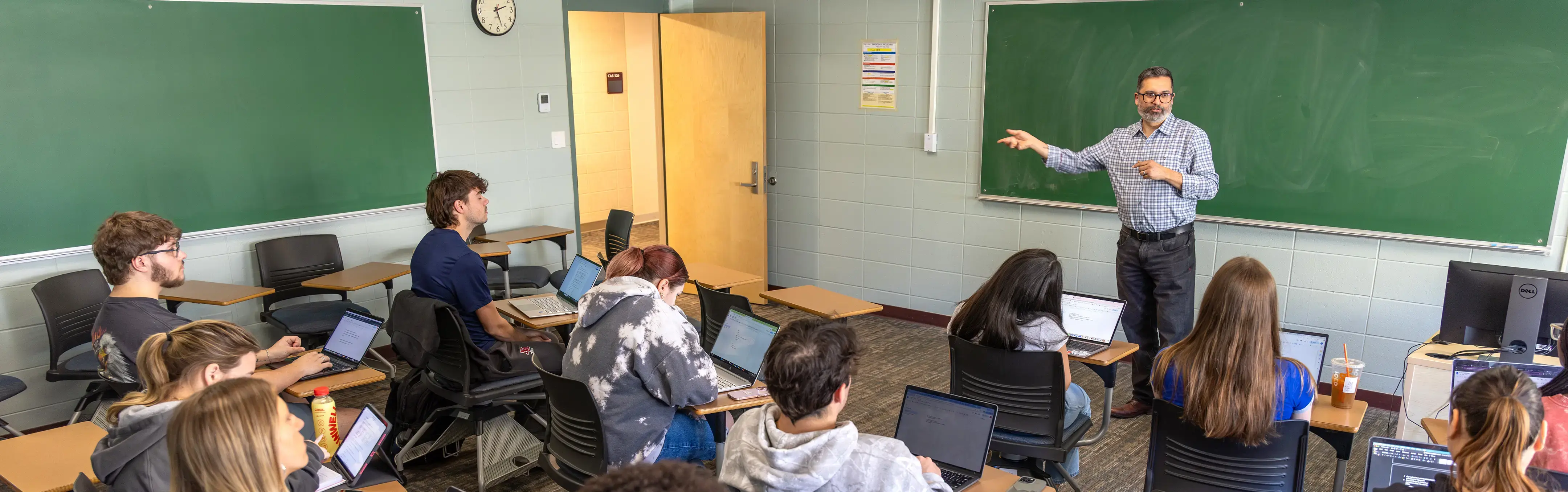 A professor teaches in a classroom