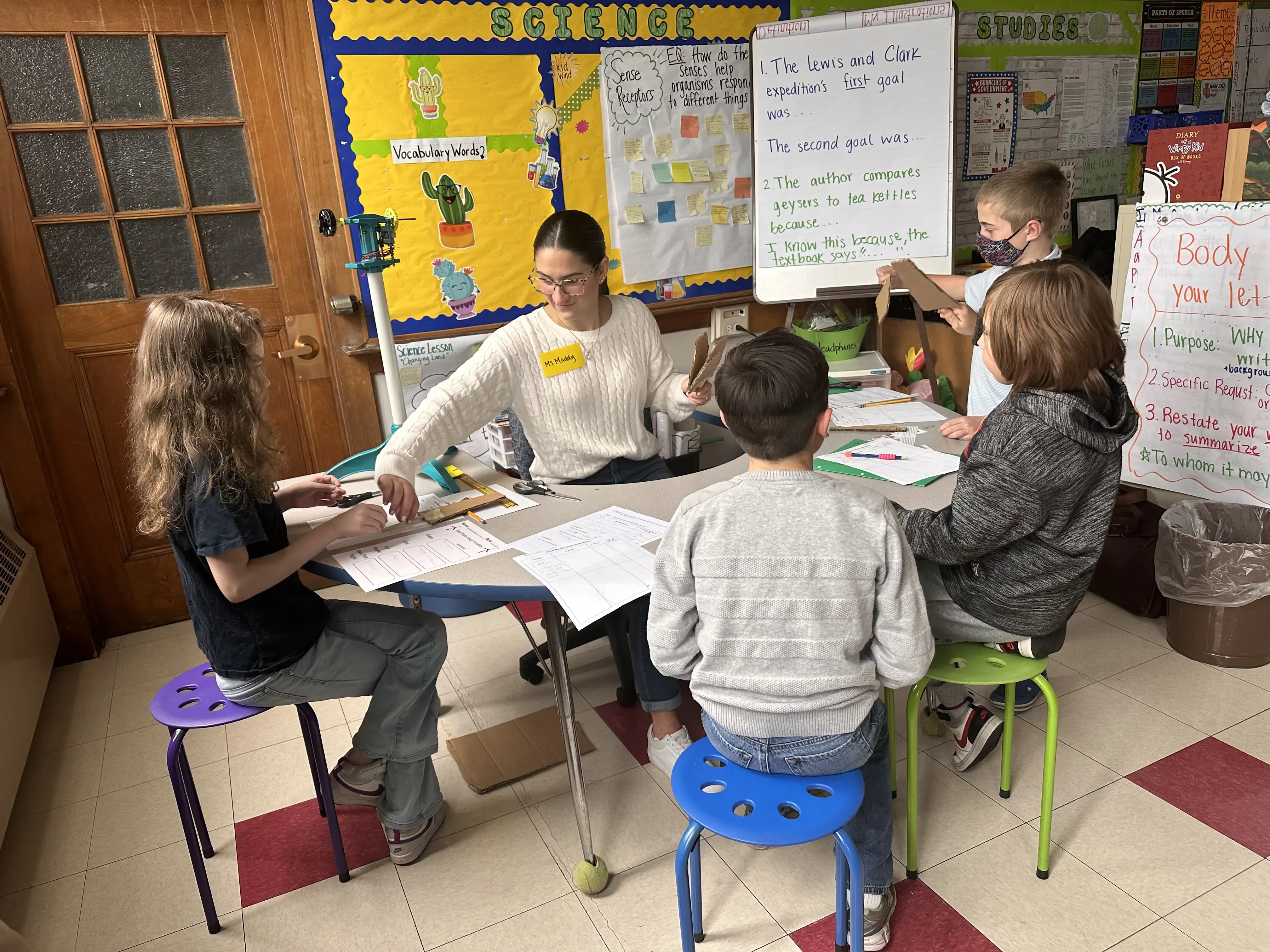 A teacher teaching to students