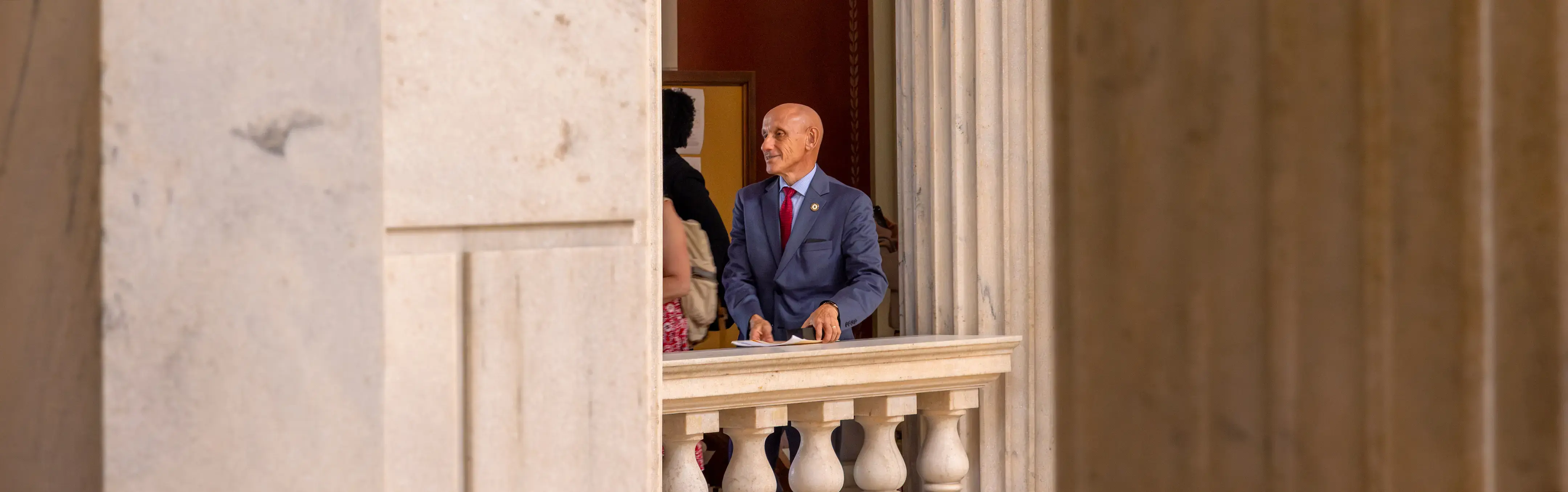 A state senator stands in the state house