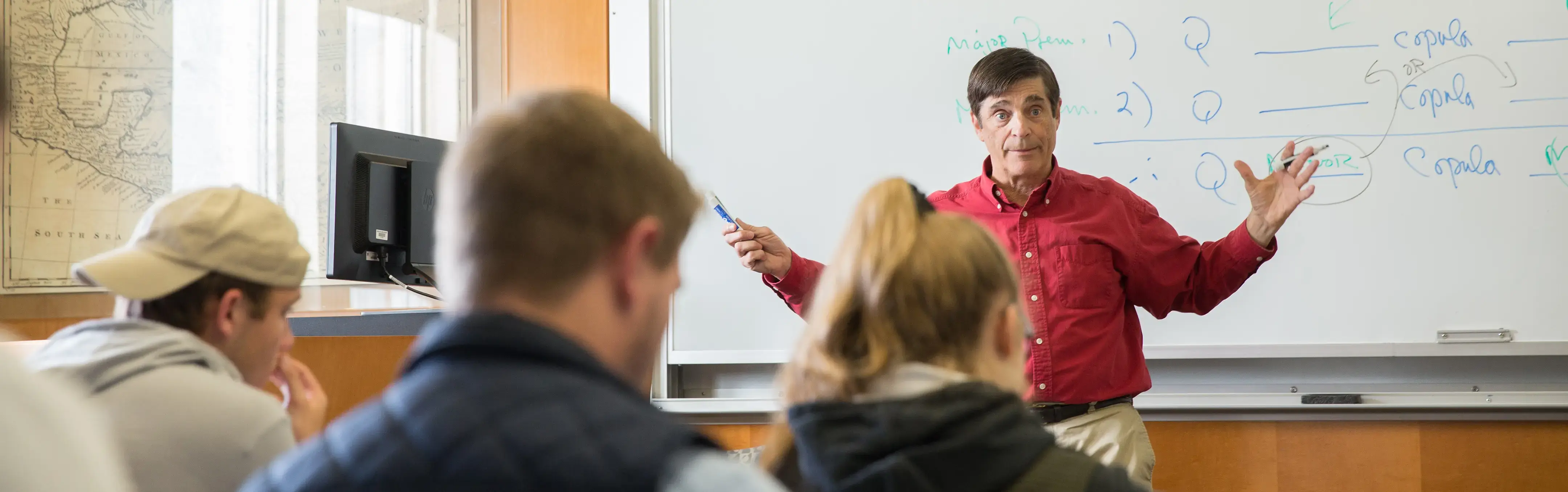 A professor lectures to a Philosophy class