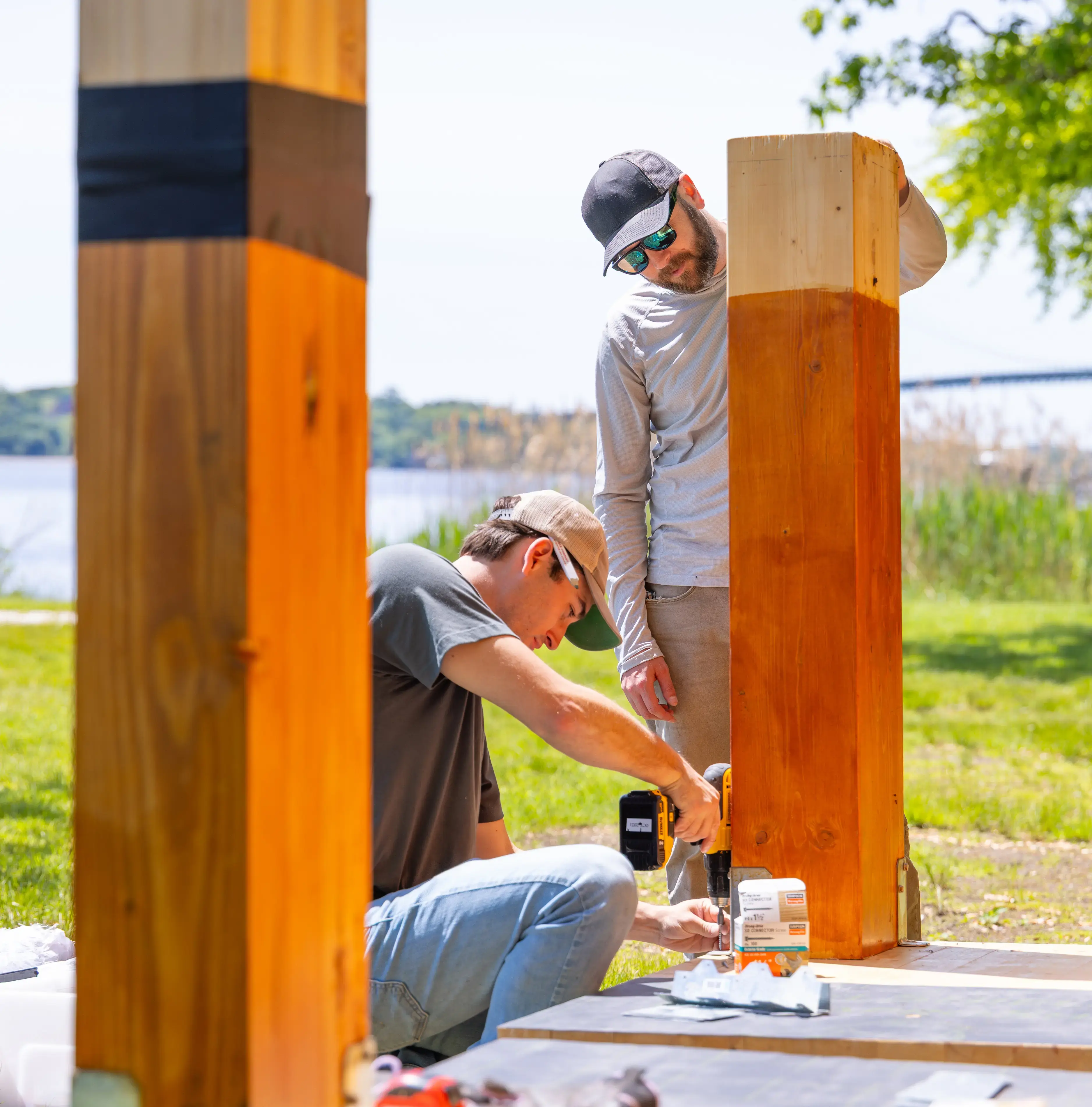 A professor and student work on a project using sustainable building practices