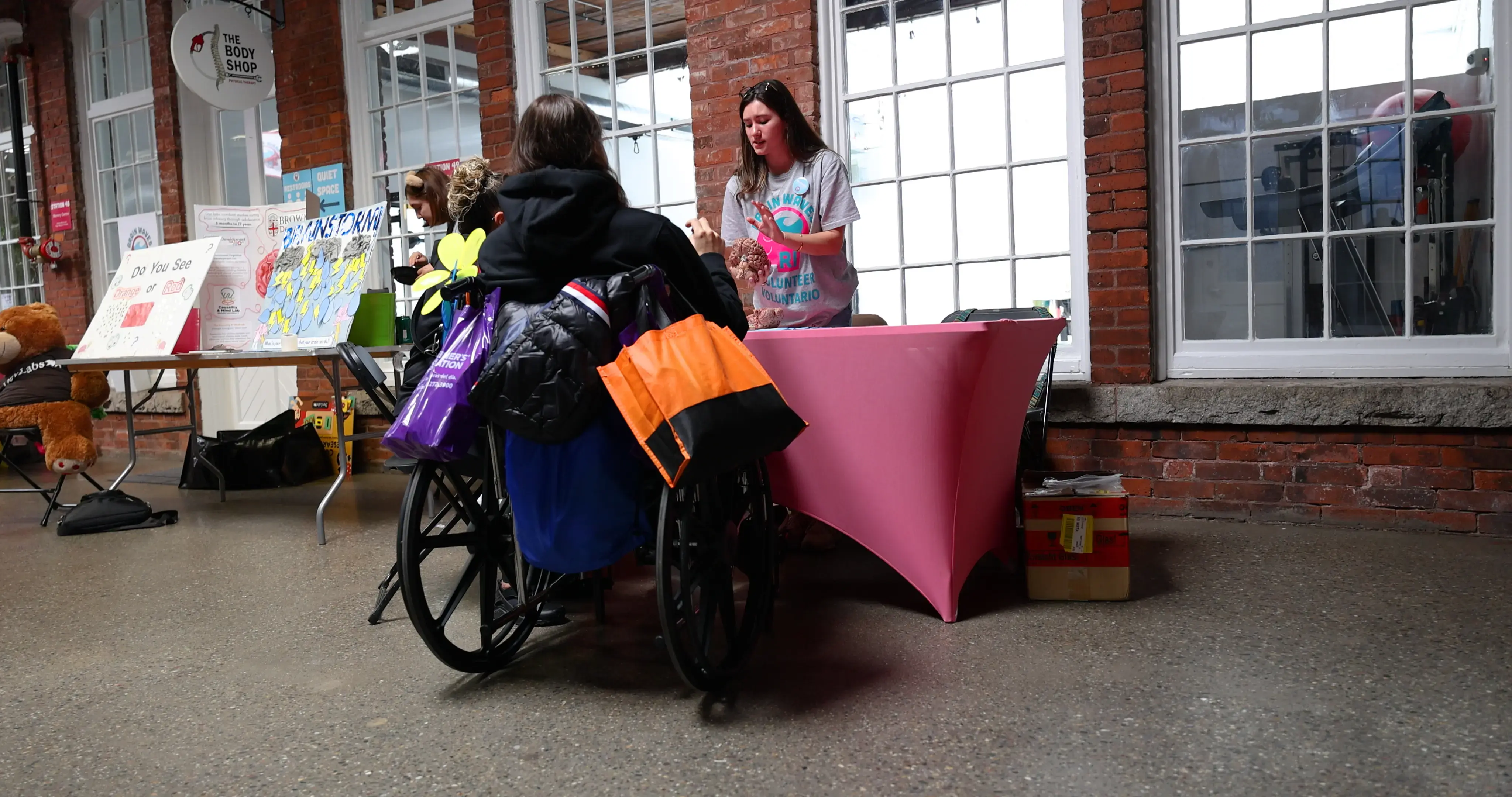 A student explains the workings of the brain to a member of the public