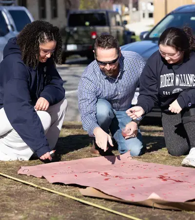 Criminal Justice Students during a blood splatter lab
