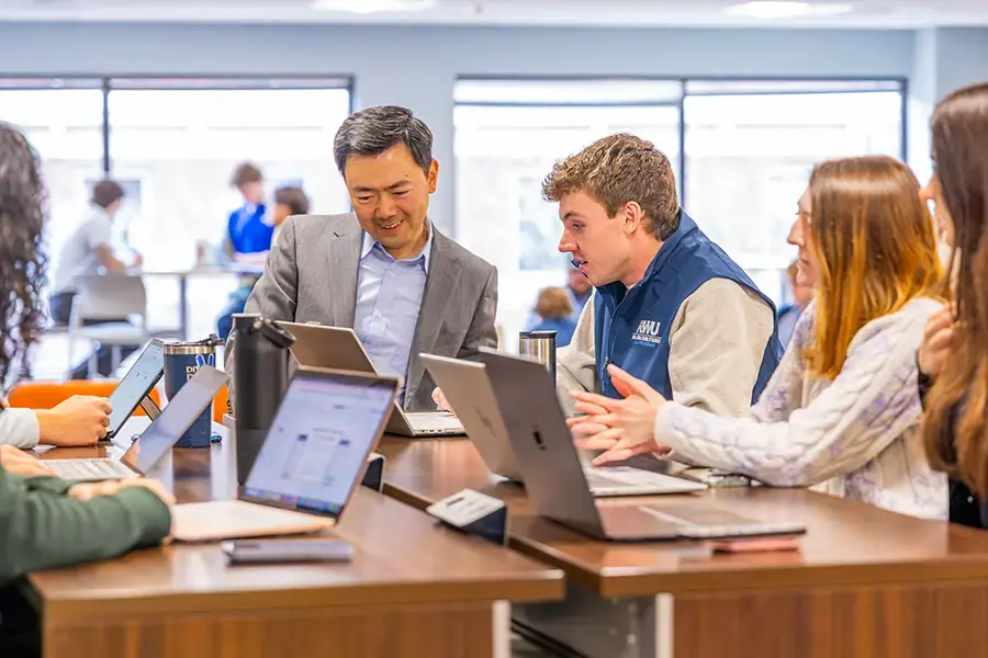 MBA professor works with students