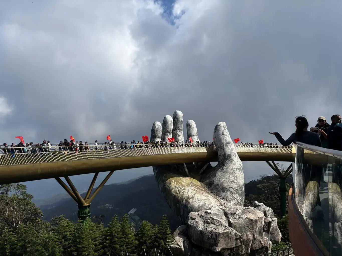 Students cross the Golden Bridge in Vietnam.