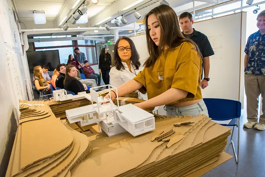 An architecture student presenting their project