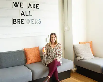 Leah Saccoccio '12 holding a can of Natural Light's new Naturdays beer. 