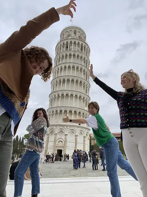 Architecture students in Italy with the Leaning Tower of Pisa.