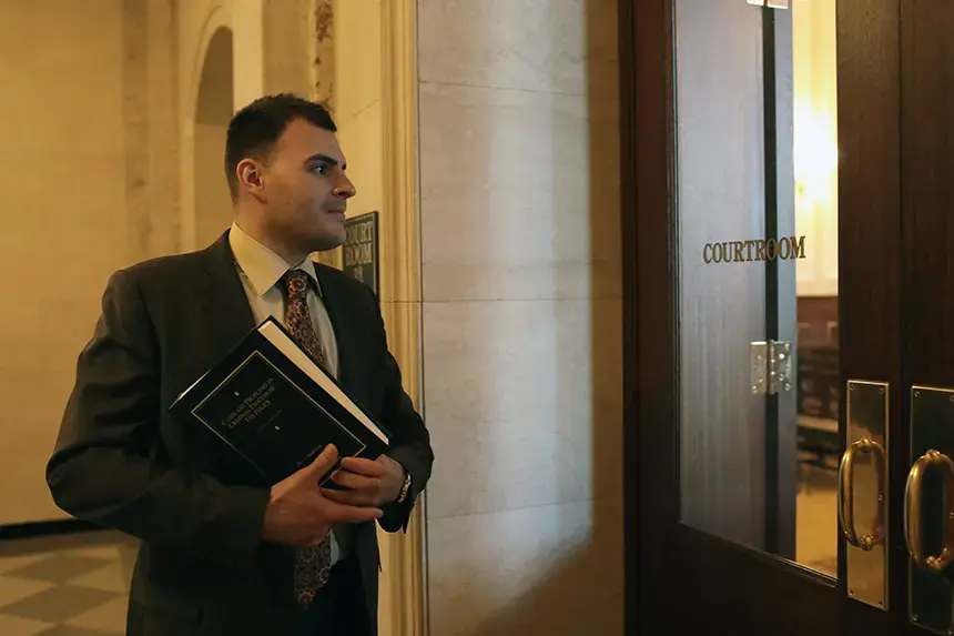 A Law student entering a courtroom