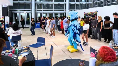 Students fill the atrium with movement during Noche Latina, dancing together as RWU kicks off its Hispanic Heritage Month celebrations.